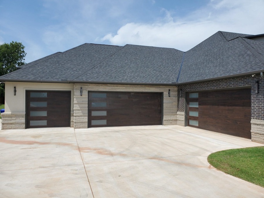 Double walnut-finish garage doors on a new home
